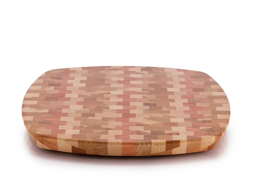 Top view of a rectangular end-grain lazy susan with rounded corners, featuring a geometric mosaic pattern in various shades of light and reddish-brown wood, on a white background