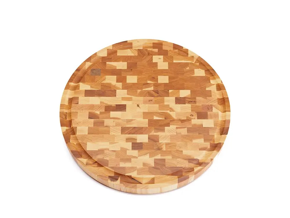 Top view of a round end-grain cutting board with a checkered pattern of various wood tones, featuring a smooth finish, against a white background