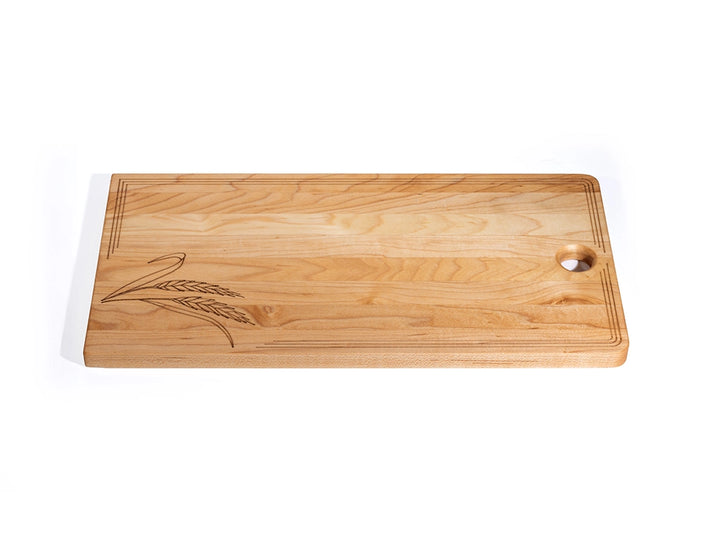 Sugar maple charcuterie board with laser-engraved wheat design, decorative border, and hanging hole