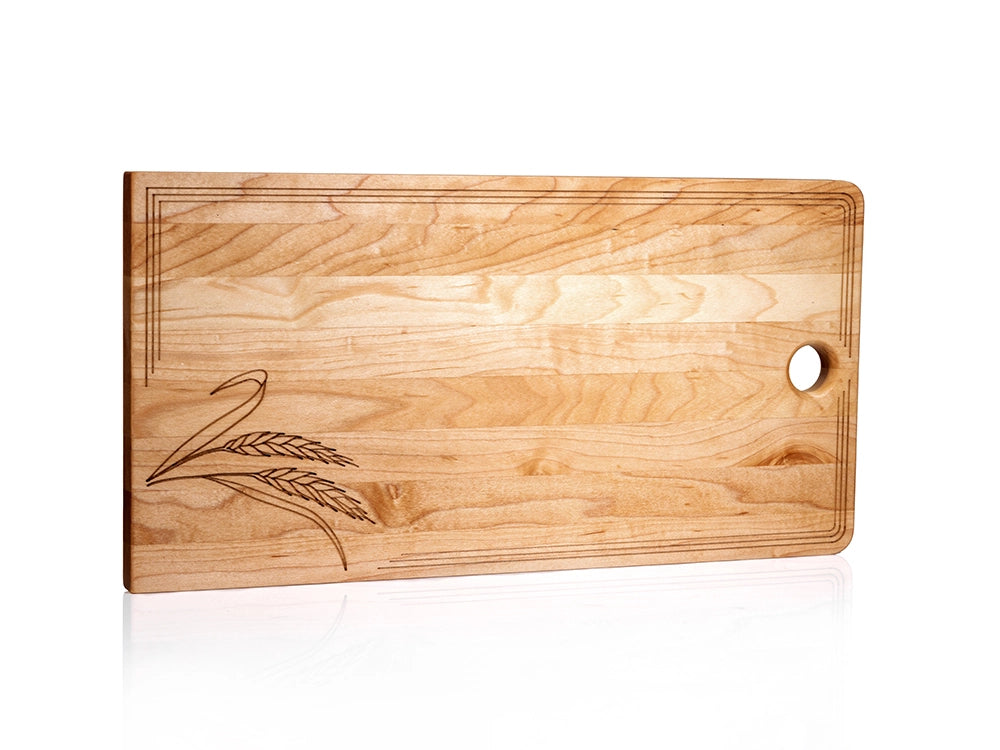 Sugar maple charcuterie board with engraved wheat stalks, laser-etched border, and thumb hole for hanging.