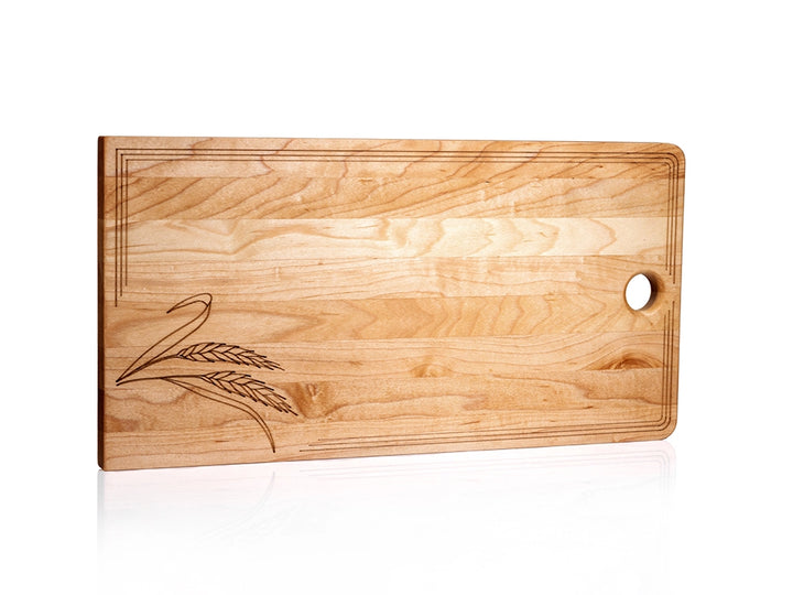 Sugar maple charcuterie board with engraved wheat stalks, laser-etched border, and thumb hole for hanging.