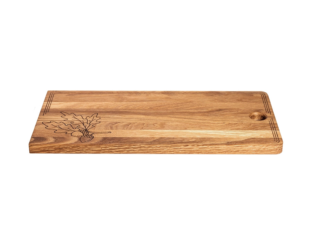 Amish-crafted white oak charcuterie board showing thickness, grain detail, and decorative engraving