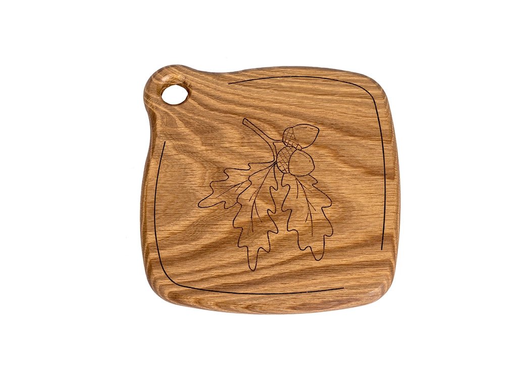 A top angle view of a Wooden Trivet with a Wheat flower design on a white background