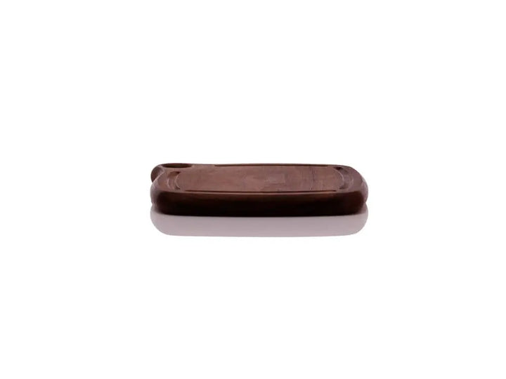 Front view of the Iron Wood Trivet, showcasing its thickness and dark walnut wood with a smooth, glossy finish. The trivet is displayed on a white background